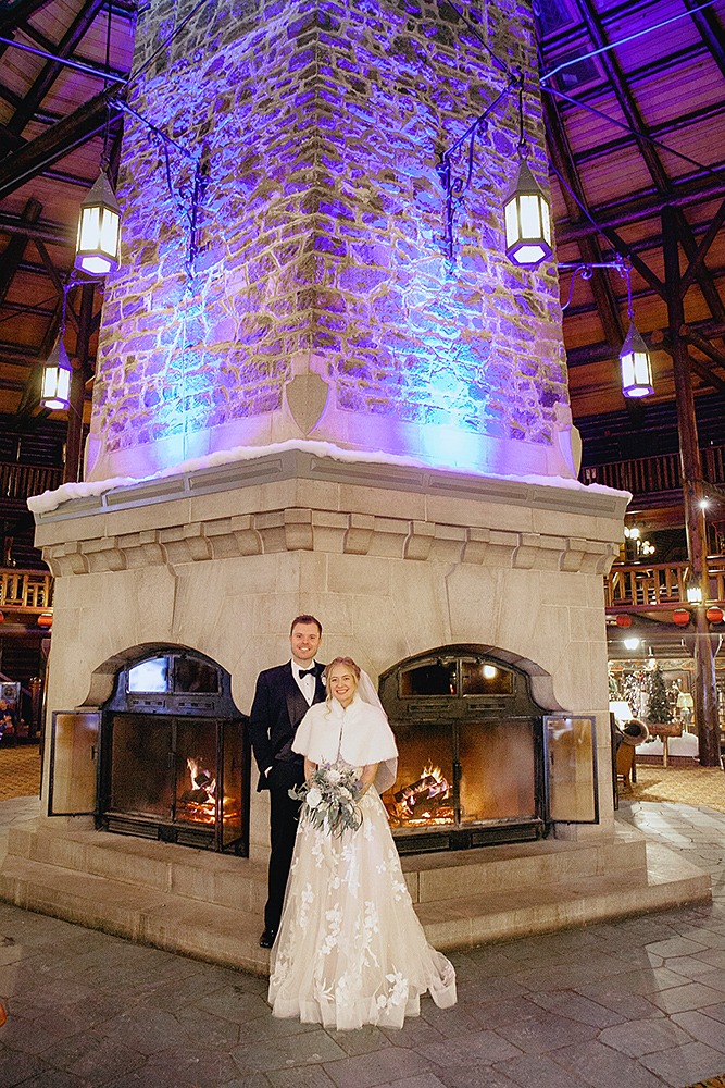 Fairmont Le Chateau Montebello winter wedding couples by fireplace Photogapher Eva Hadhazy