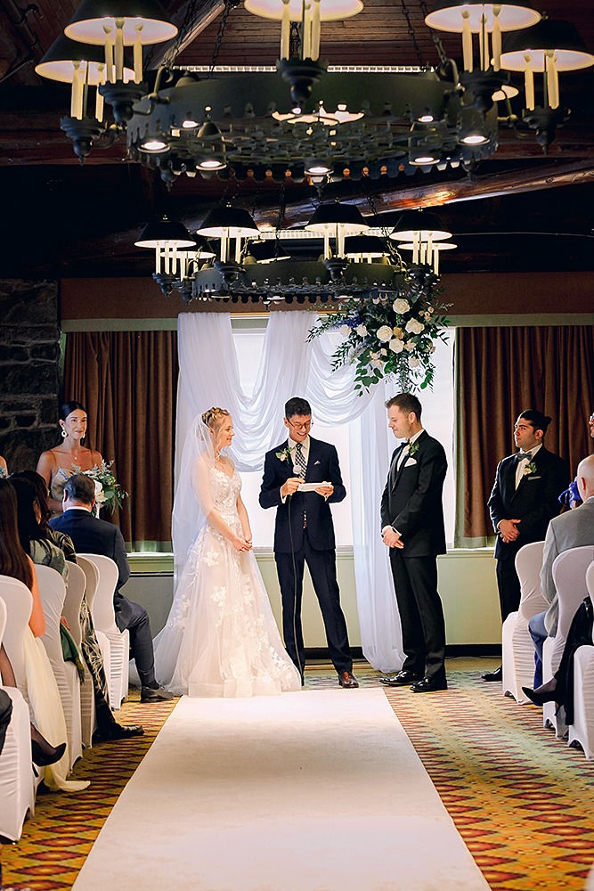 Winter wedding ceremony inside at Chateau Montebellow