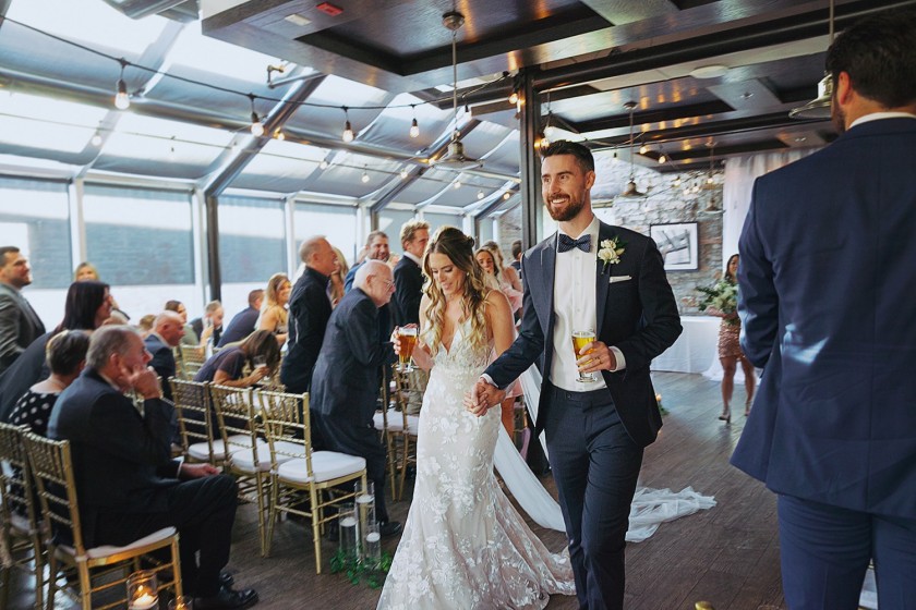 couple holding beer walking at mill street pub ottawa