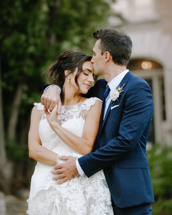 couple gently embracing each other at strathmere in ottawa