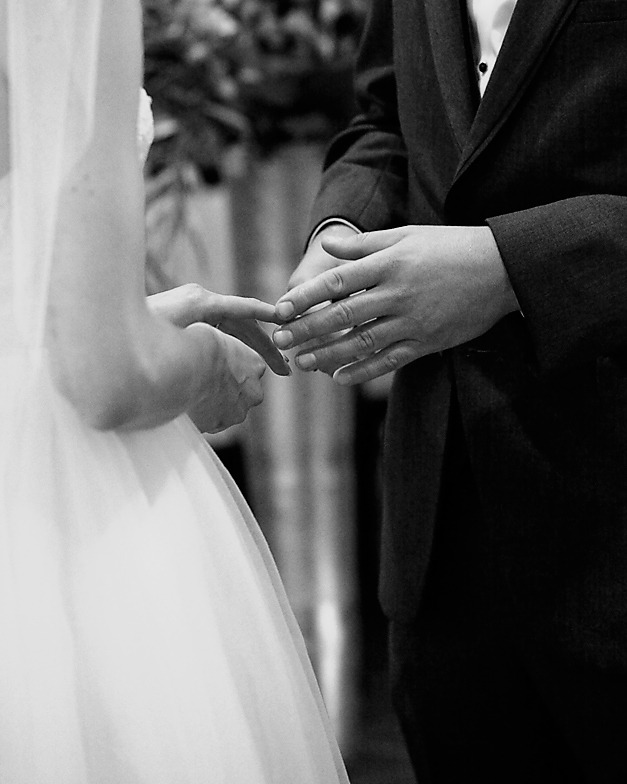 couple is touching each other fingers gently at Museum of Nature