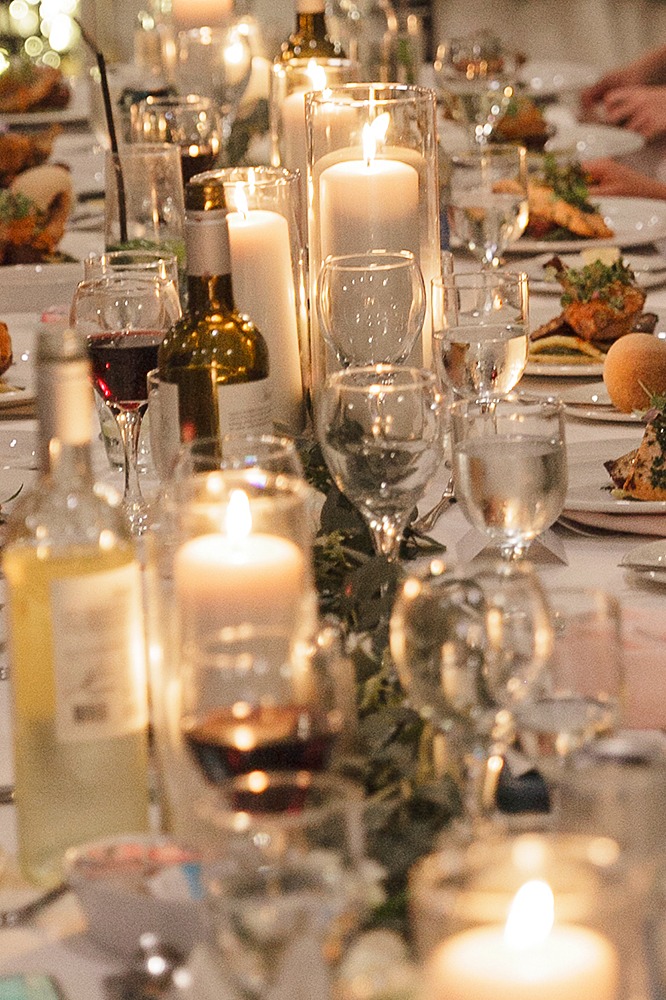 Elegant farmhouse wedding table decor with candles and florals at Strathmere wedding venue.