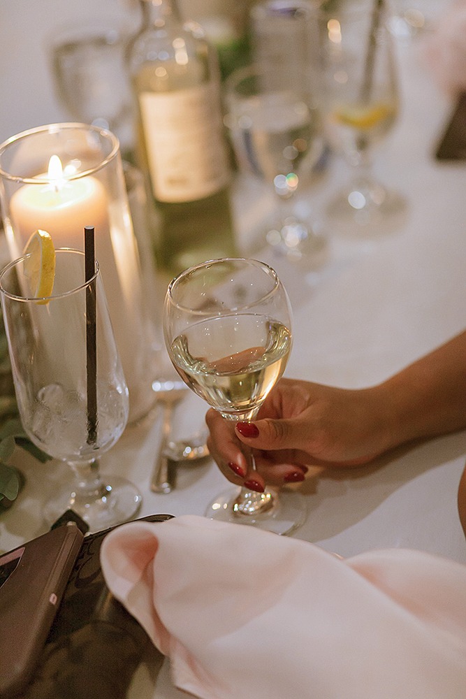 Elegant farmhouse wedding table decor with candles and florals at Strathmere wedding venue.