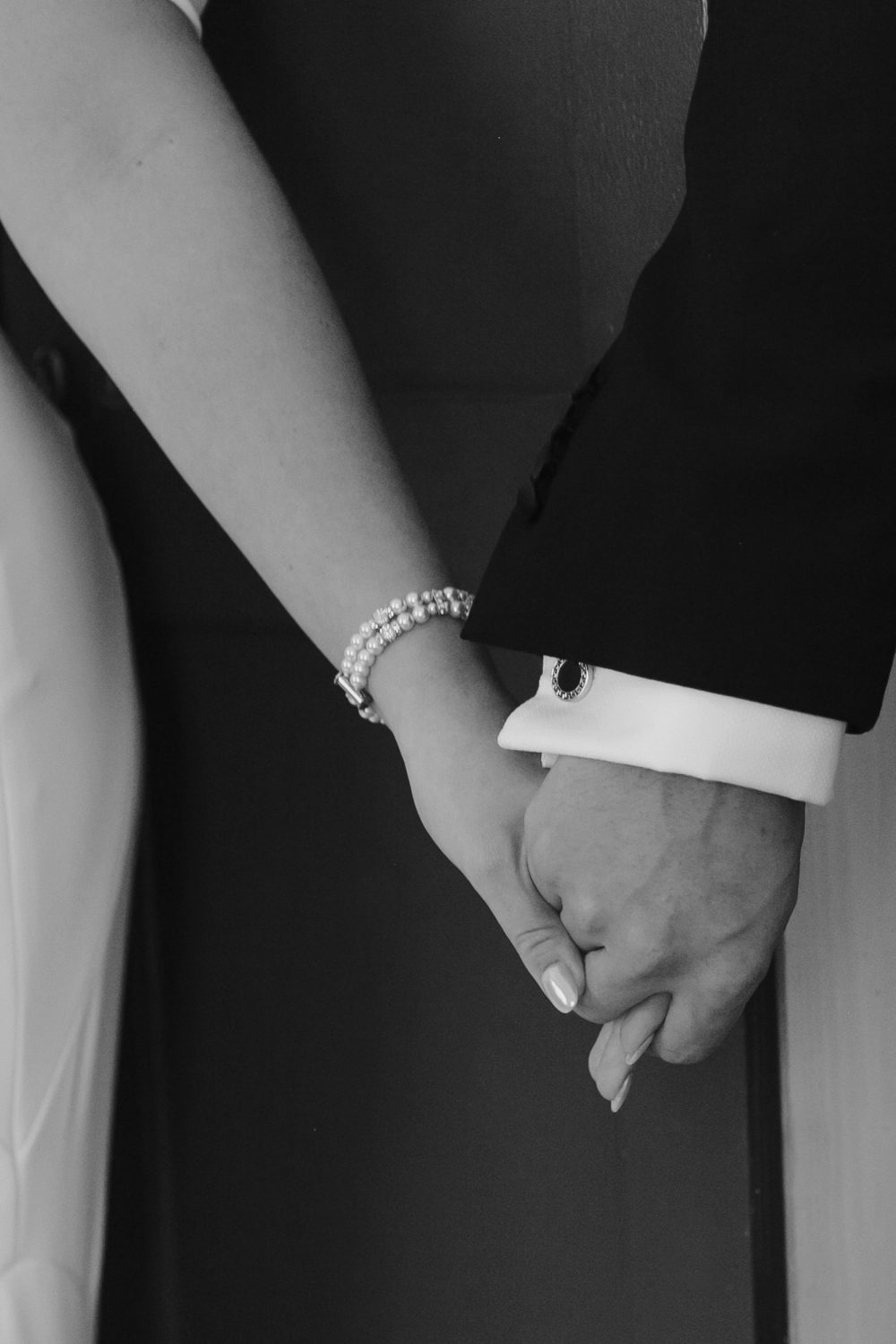 Kristine holding hands with Jamie through the door before ceremony
