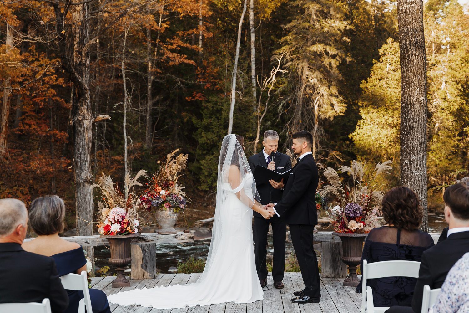 Couple exchanging vows during October wedding