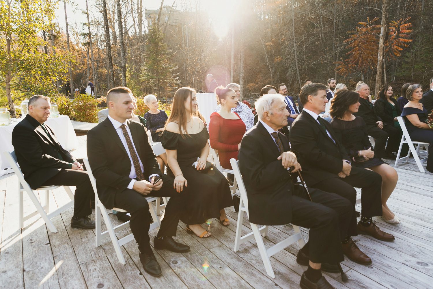 Guests watching intimate outdoor ceremony