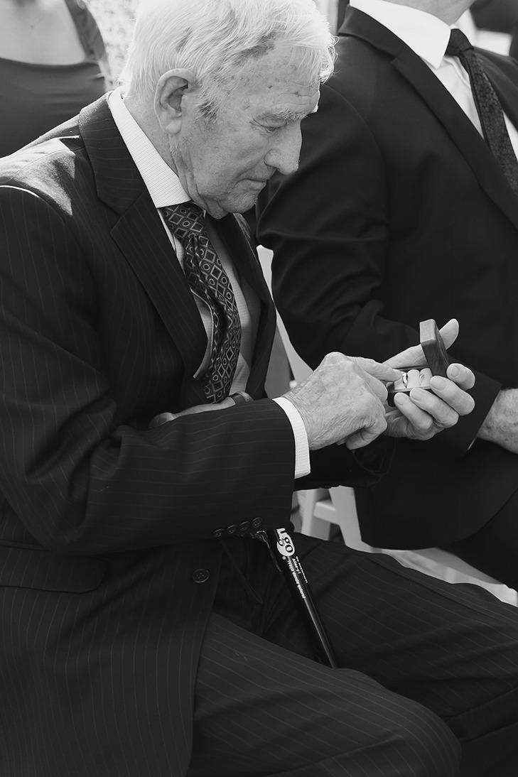 Guests watching intimate outdoor ceremony
