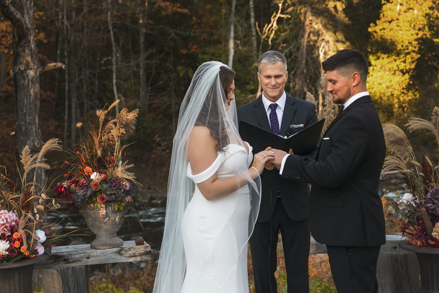 Couple exchanging vows during October wedding