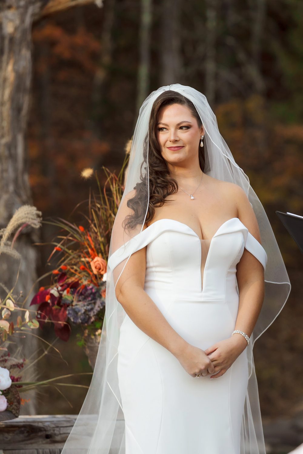 Couple exchanging vows during October wedding