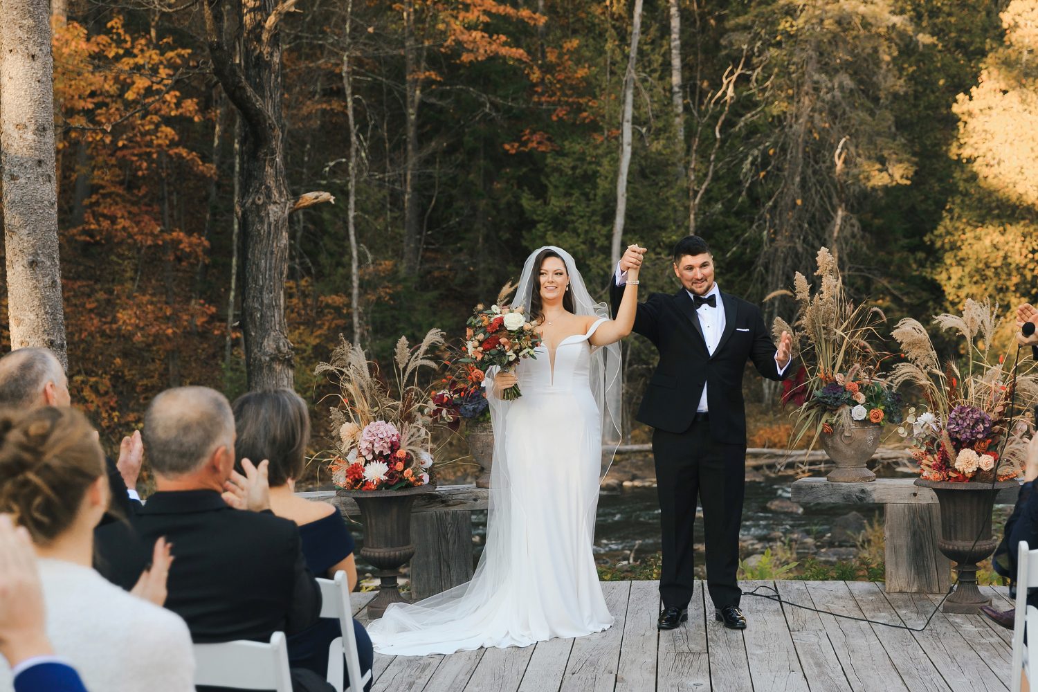Just married moment under fall leaves