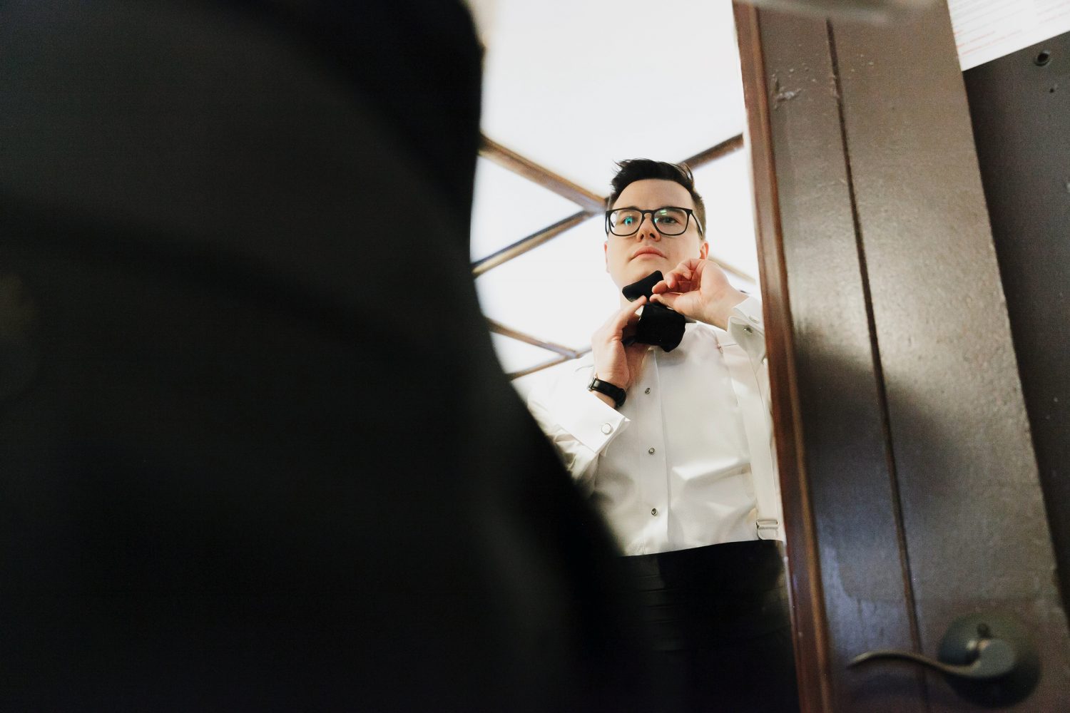 Julien the groom is getting ready at chateau montebello winter wedding