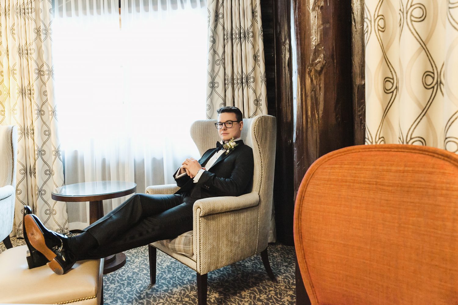 Editorial portrait of groom inside chateau montebello