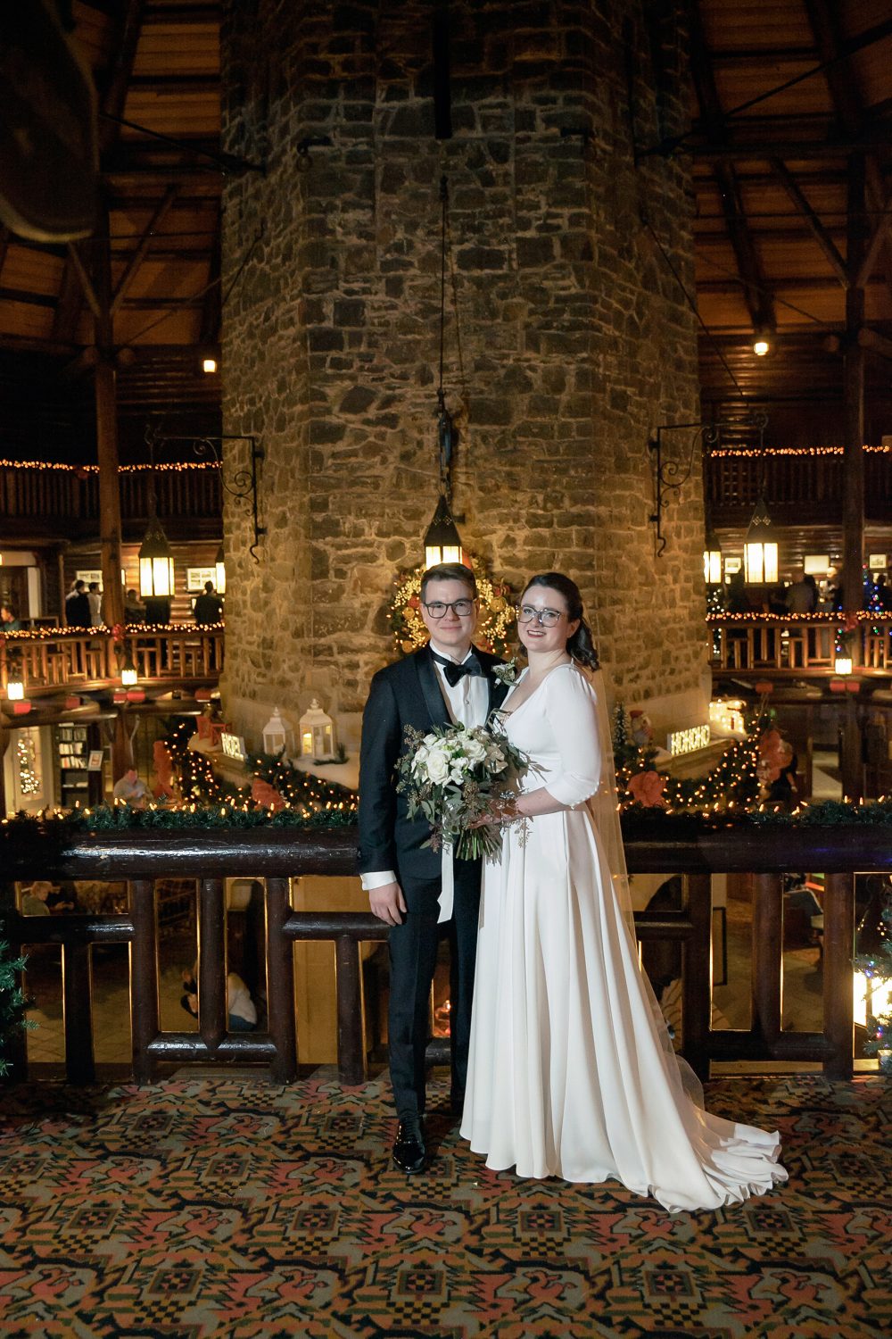 Bride and groom photo by fireplace at Chateau Montebello