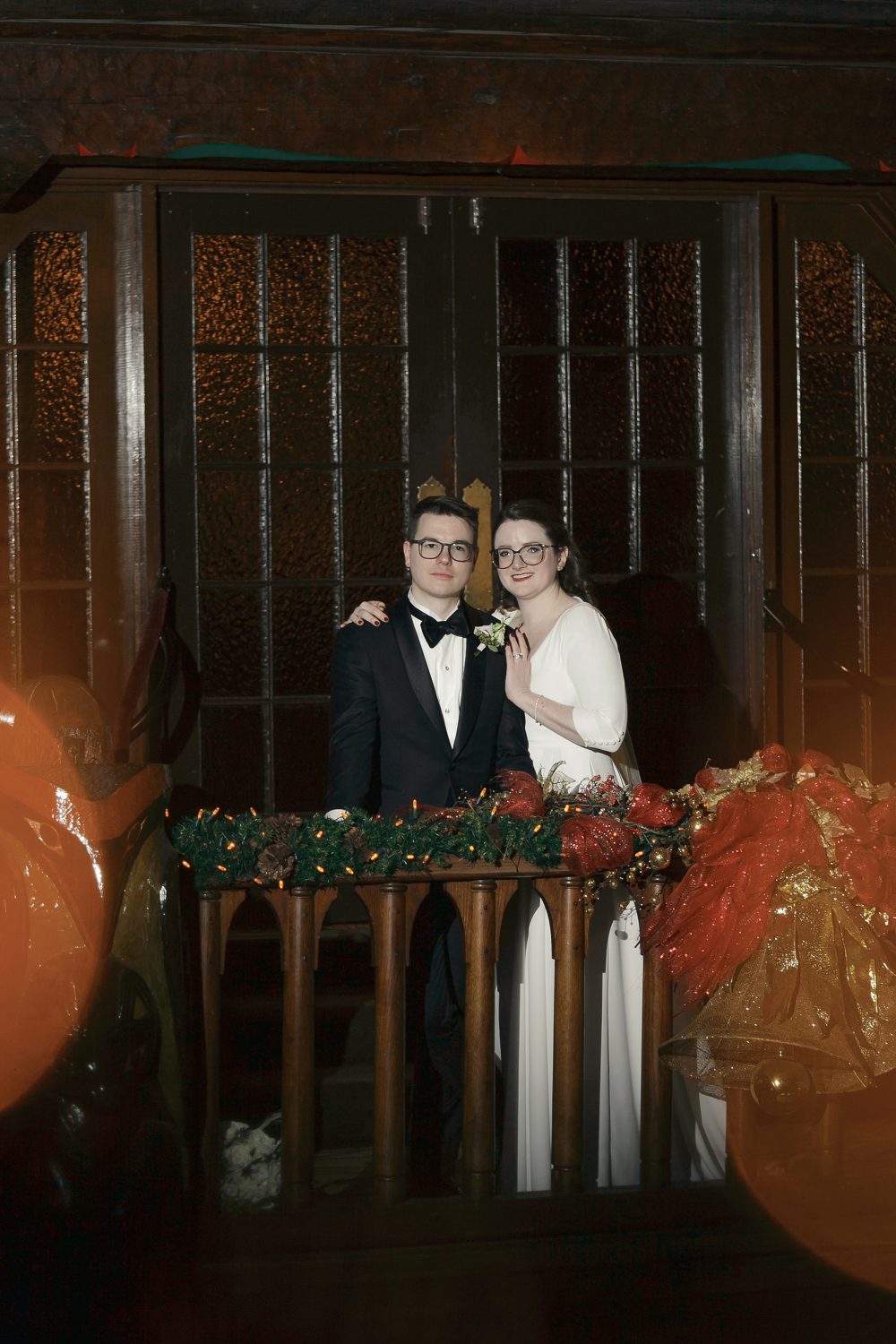 Bride and groom photo by fireplace at Chateau Montebello and in the foyer