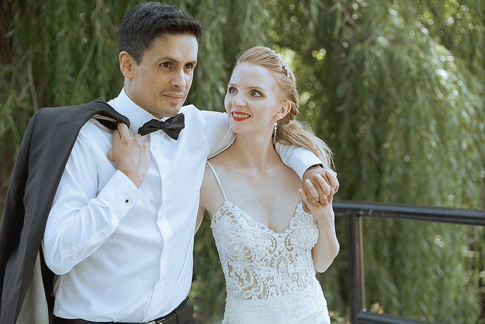 Bride and groom candid portraits among trees in the Ottawa Arboretum