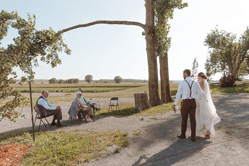 Domaine Perrault Winery Wedding couple is chatting with grandparents 