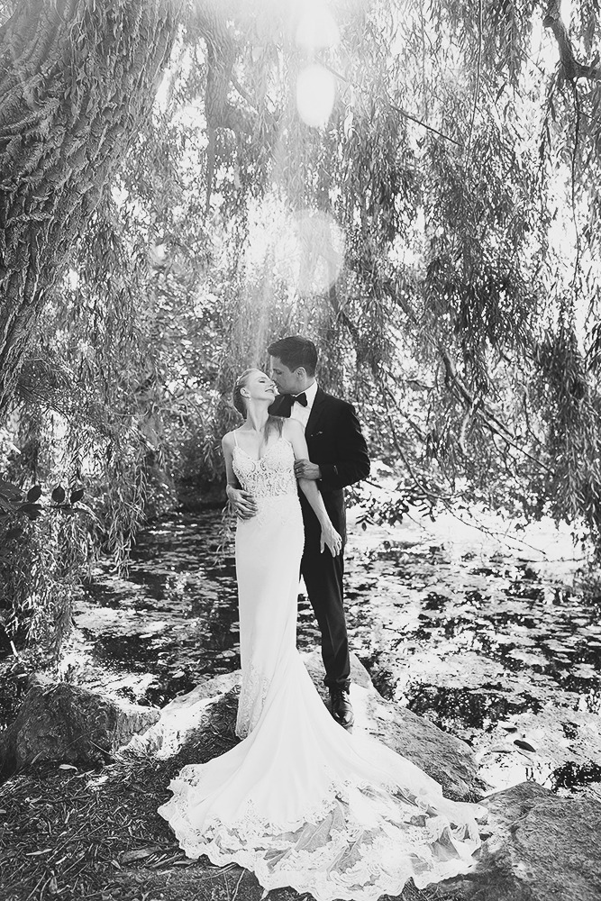 Bride and groom candid portraits among trees in the Ottawa Arboretum