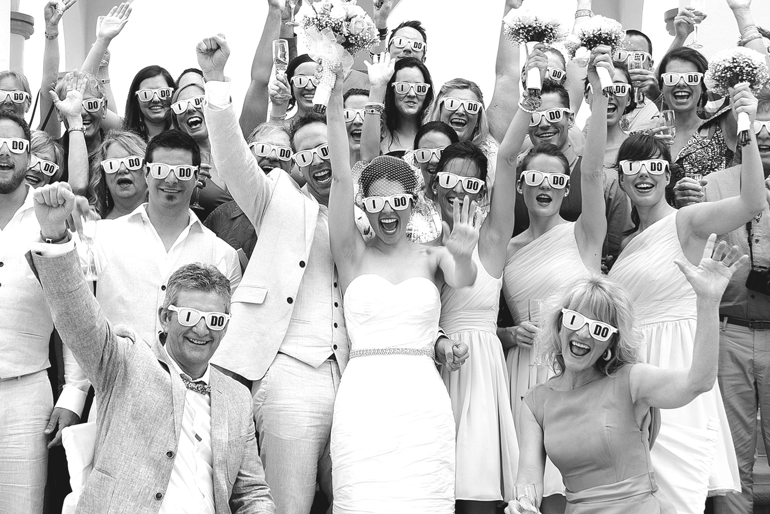 Destination wedding guest cheers after ceremony