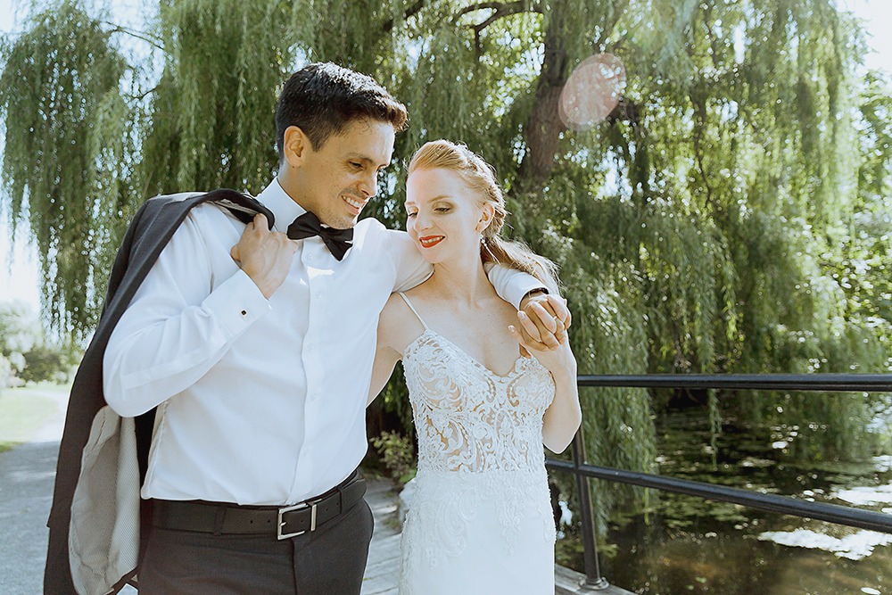 Bride and groom candid portraits among trees in the Ottawa Arboretum