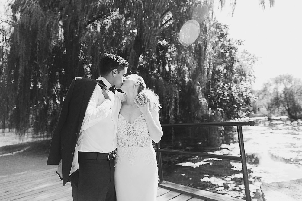 Bride and groom candid portraits among trees in the Ottawa Arboretum