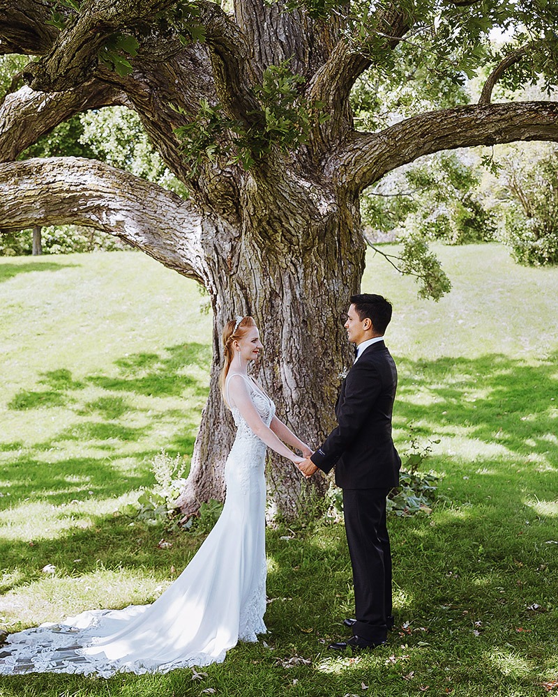 couple is exchanginng vows during an ottawa arboretum intimate wedding ceremony