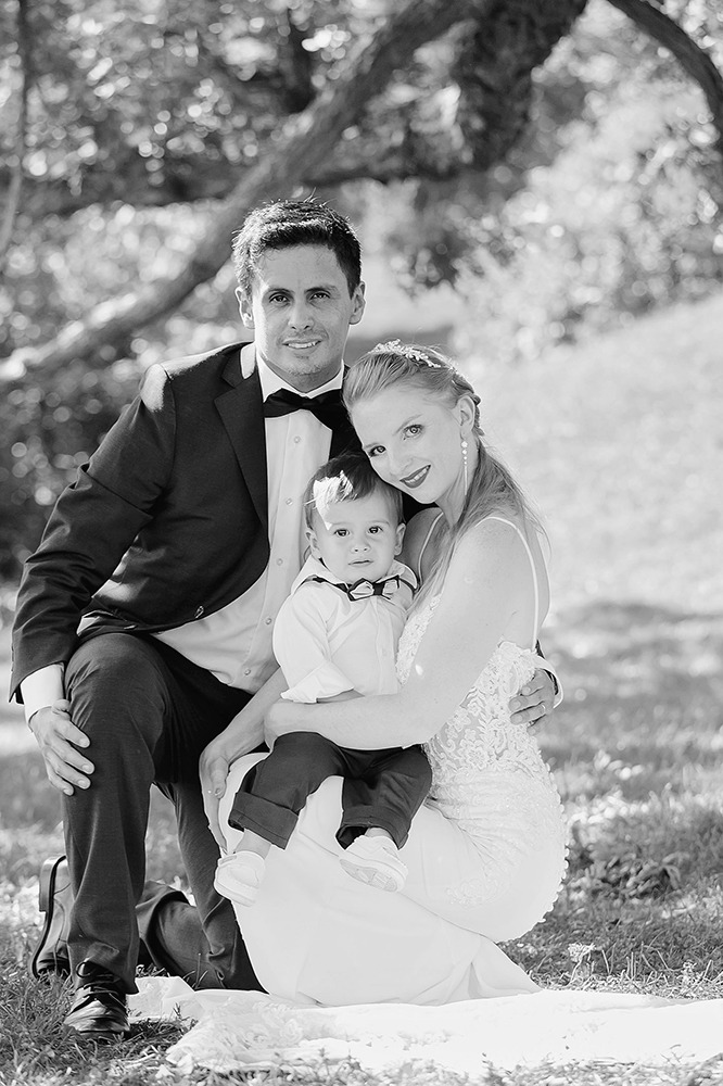 Bride and groom embracing outdoors in the Ottawa Arboretum.