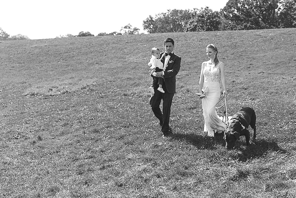 Bride and groom posing for portraits among trees in the Ottawa Arboretum