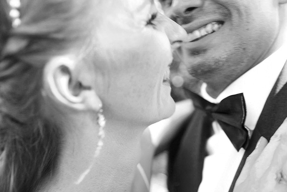 Bride and groom posing for portraits among trees in the Ottawa Arboretum