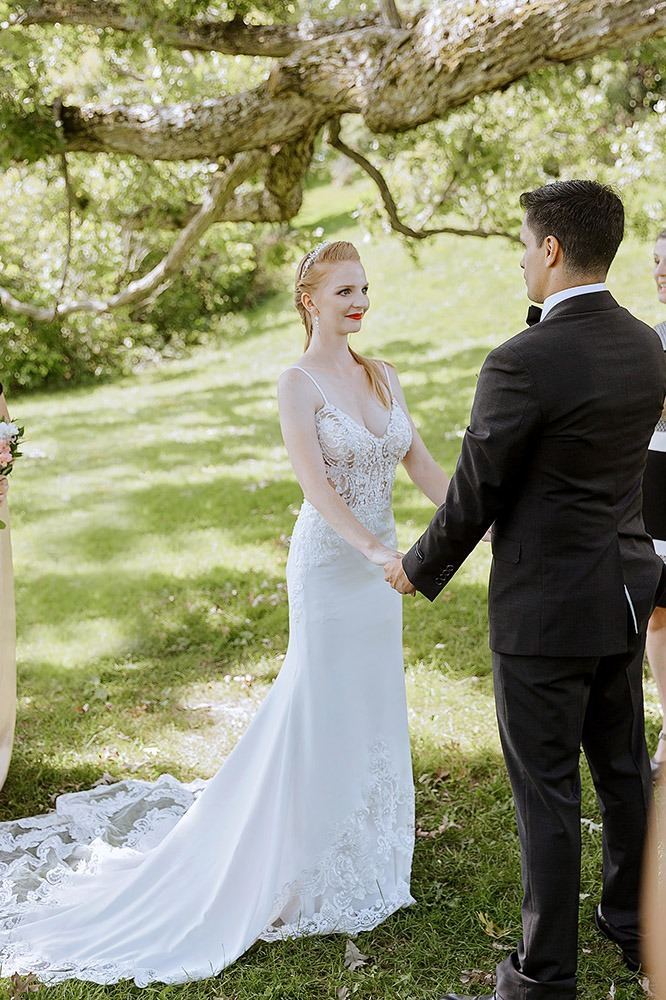 couple is exchanginng vows during an ottawa arboretum intimate wedding ceremony